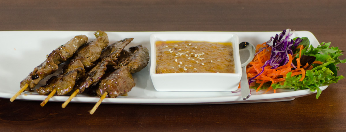 bbq beef with peanut sauce and salad