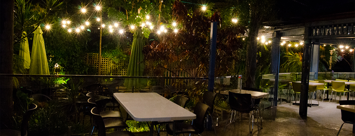 Thai Rim Nam garden dining area at night